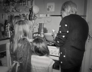 Children baking with grandmother
