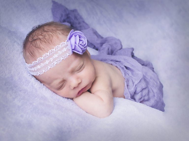 baby in purple headband