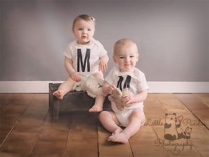 Boy girl twins with teddy