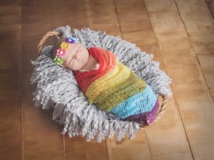 Rainbow baby in basket