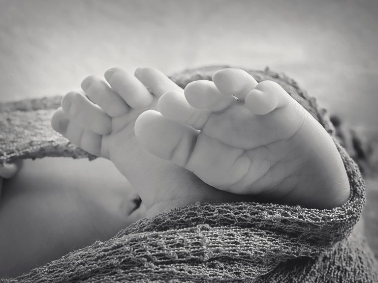Baby feet close up black and white