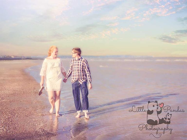 Engagement couple walking by the sea