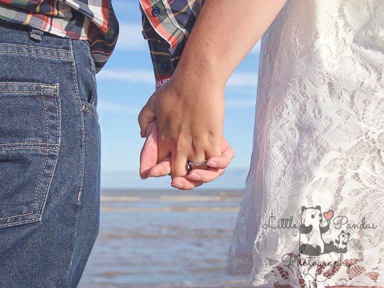 Engagement couple holding hands
