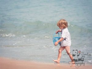 Little boy with blue bucket