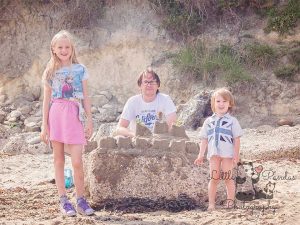 Family with sandcastle