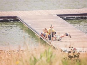Boy and girl looking in water