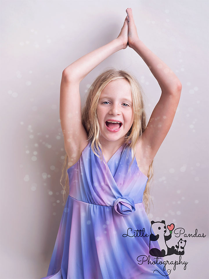 Girl with glitter falling on her