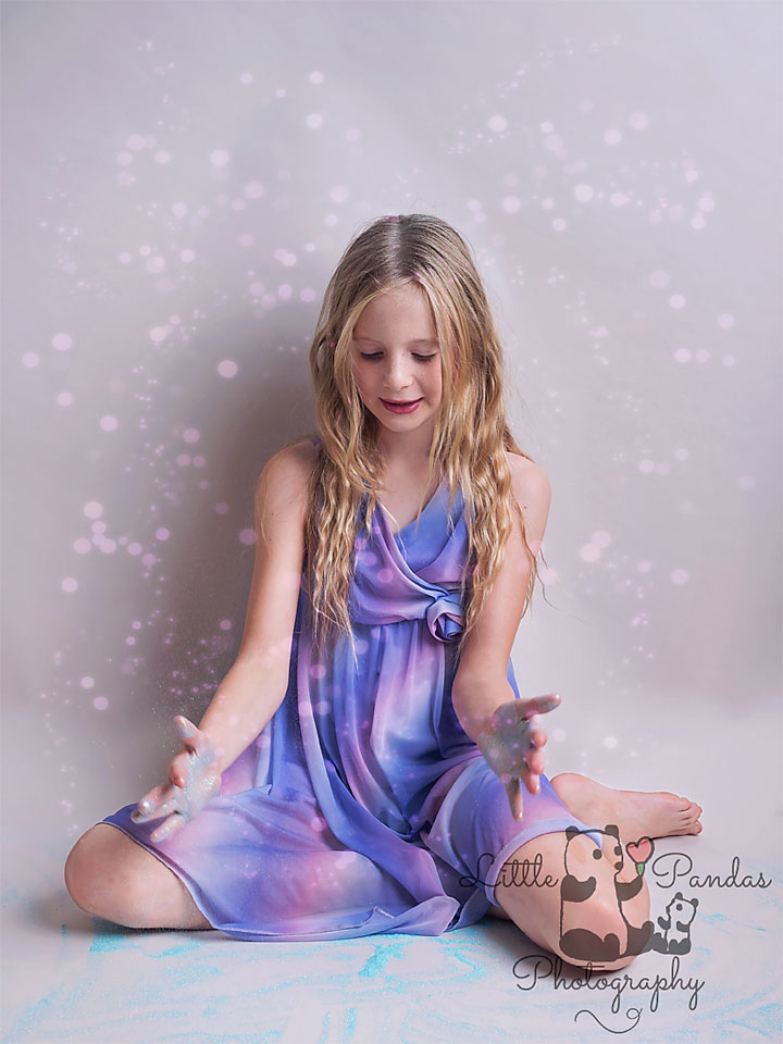 Girl with glitter around her