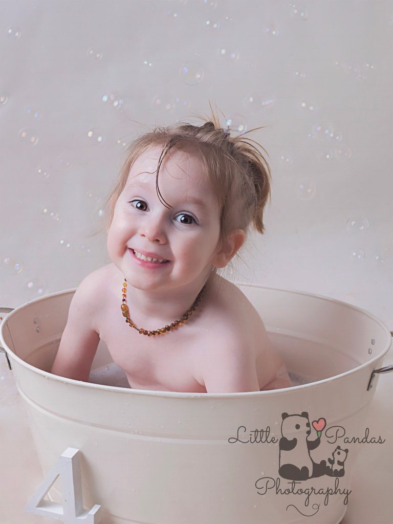 Boy in tub with bubbles