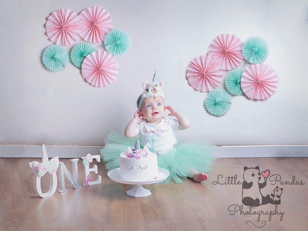 Little girl in unicorn cake smash outfit