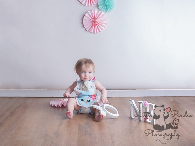 Little girl in cake smash outfit