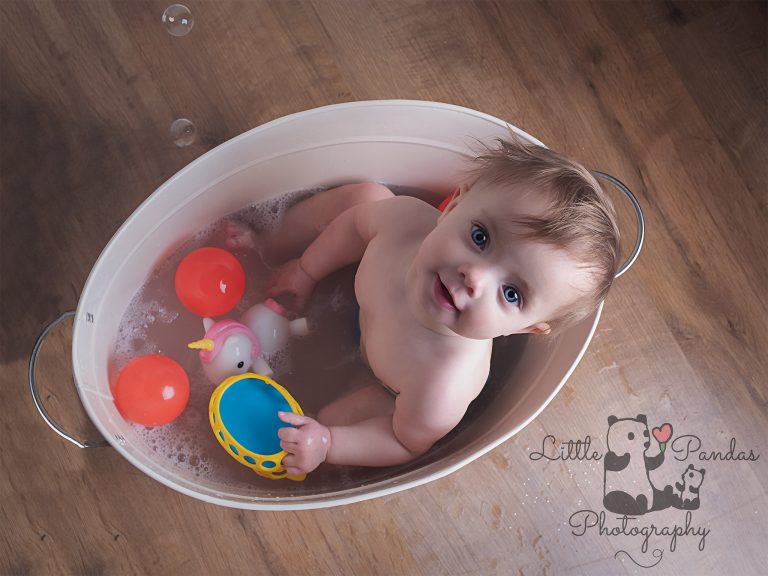 Little girl in tin bath aerial view