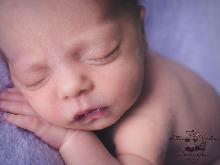 Newborn baby girl close up of face