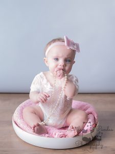 Little baby girl with pearls