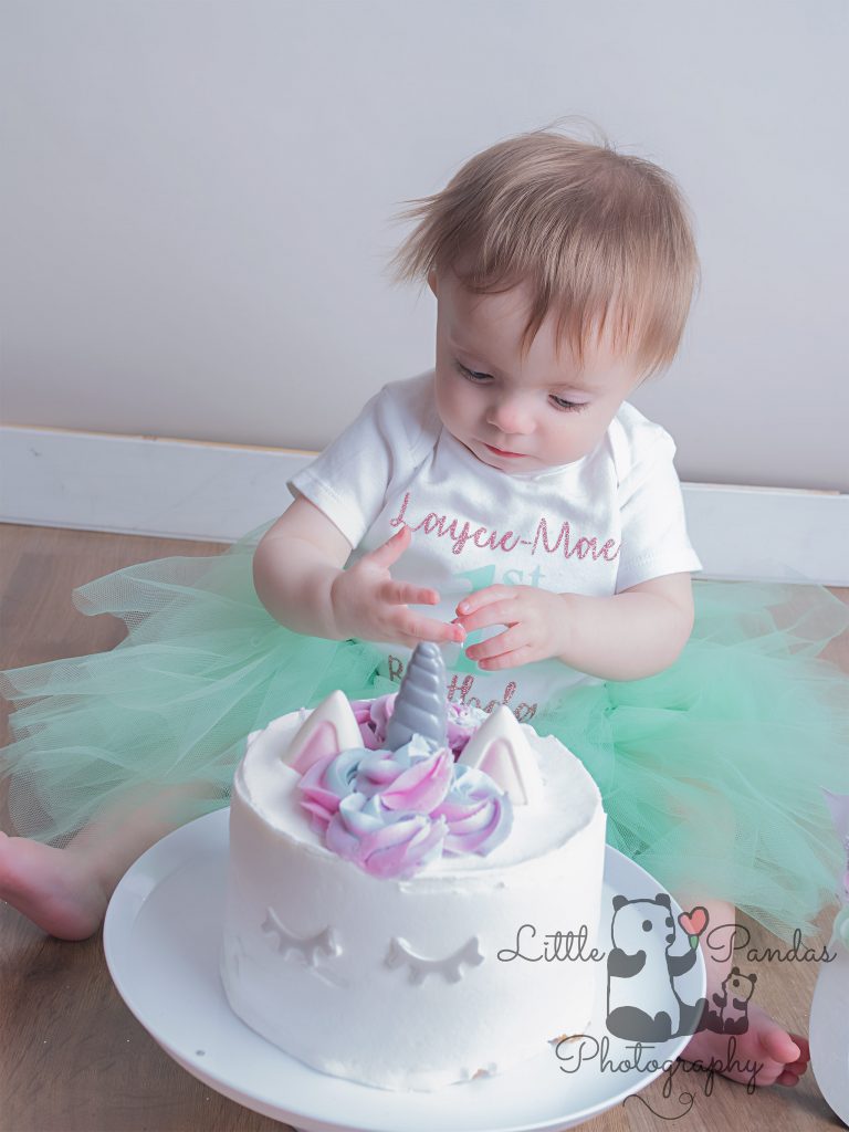 Little girl eating cake