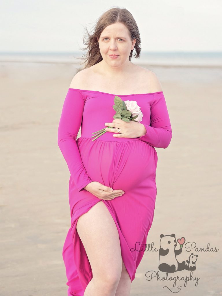Pregnant lady in pink dress with flowers