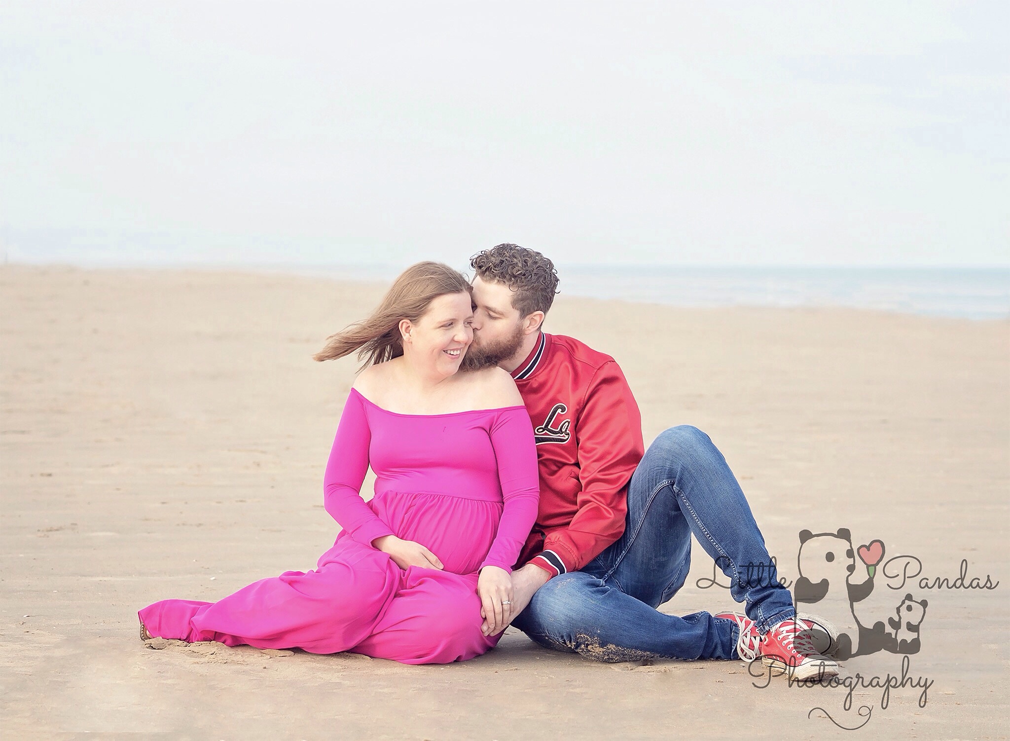 Pregnant lady husband on beach couple