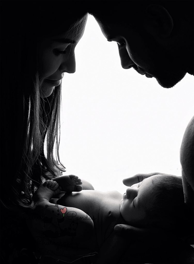 Newborn photography parents with baby silhouette